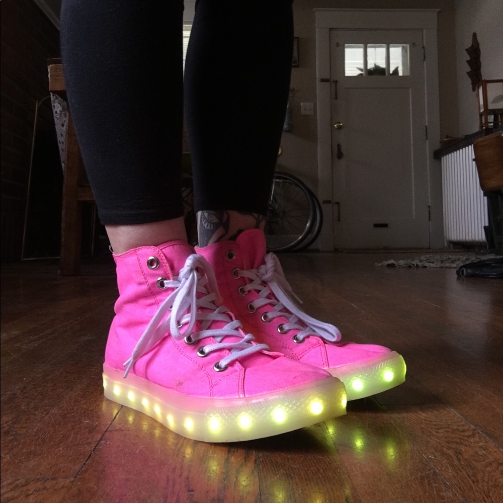 Hot pink high top sneakers with LED lights